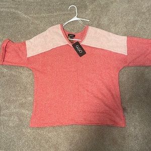 Small pink short sleeve sweater